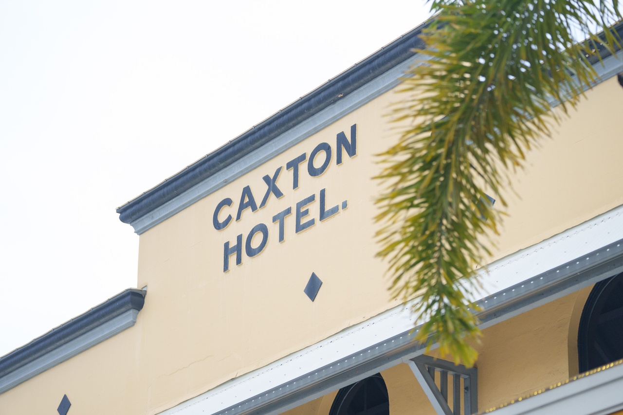 A close up of the Caxton Hotel signage.