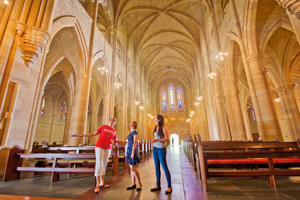 Brisbane Greeter showing two women around in a church