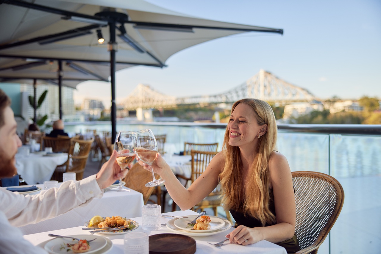 Couple dining at Tillerman beside Brisbane River