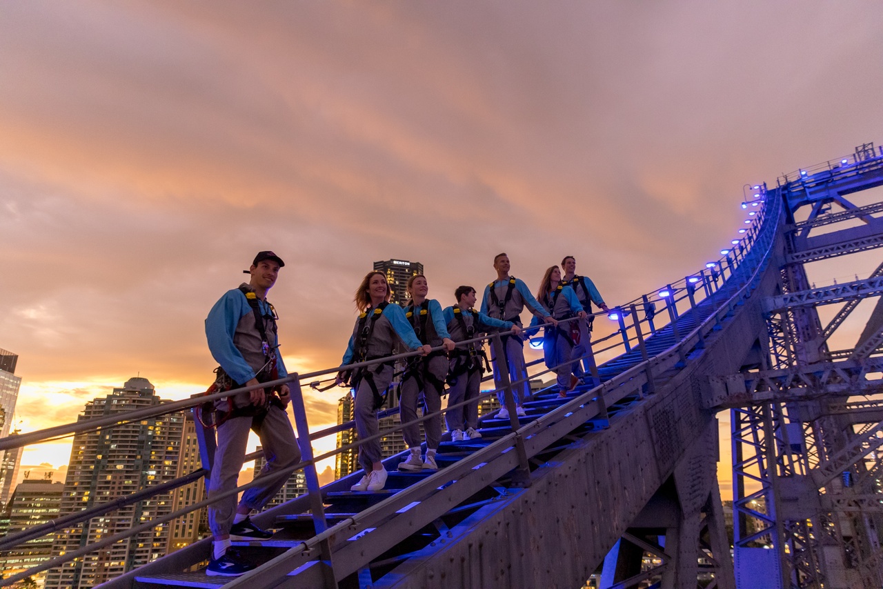 People on top of the Story Bridge in the evening.