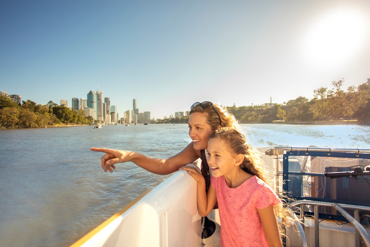 Mother and daughter riding the CityCat on the Brisbane River