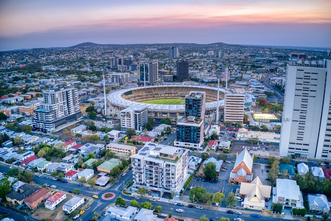 An aerial view of the sun setting behind the Gabba in Brisbane's Woolloongabba.