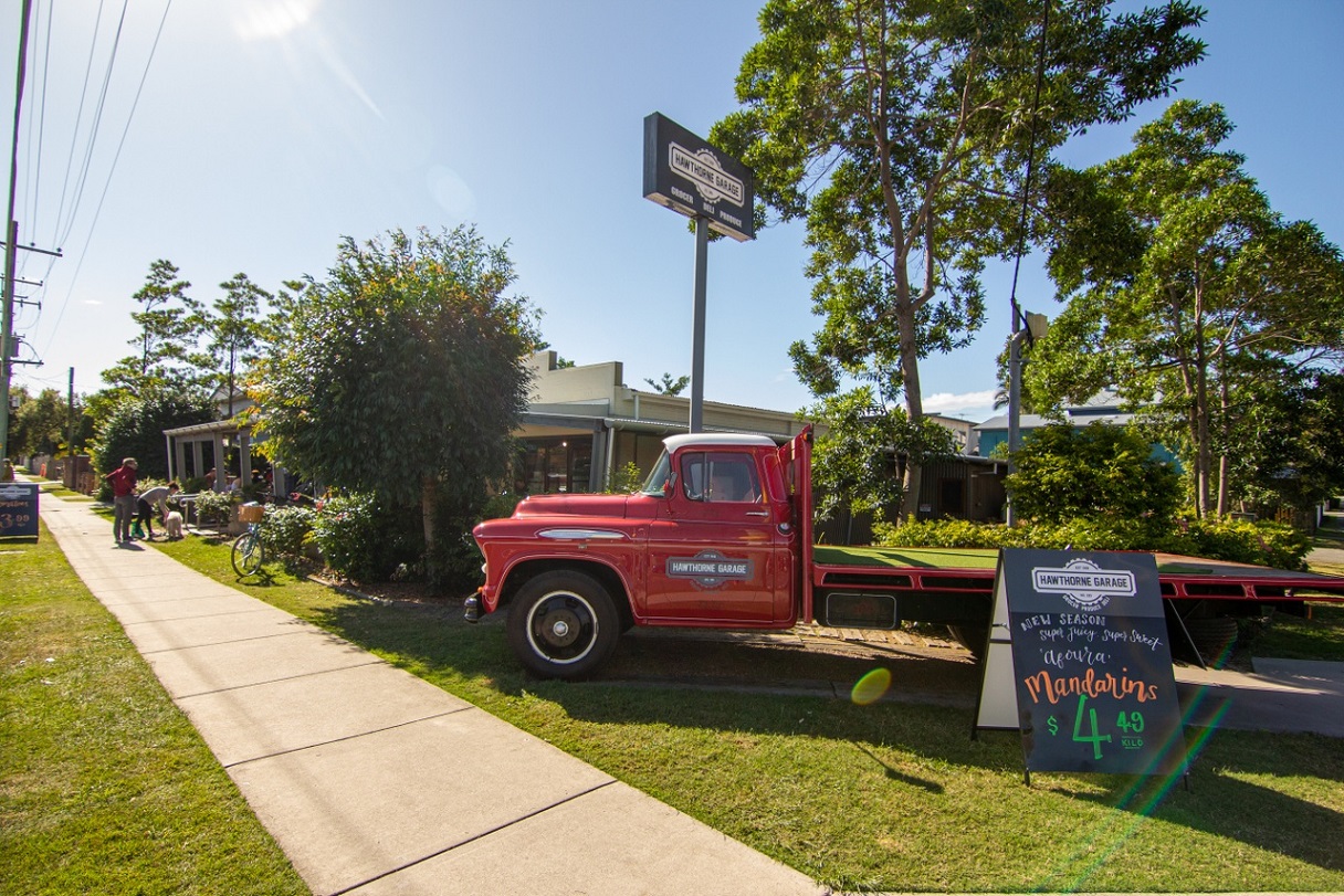 A red truck with a sign selling mandarins at Hawthorne Garage, Bulimba.