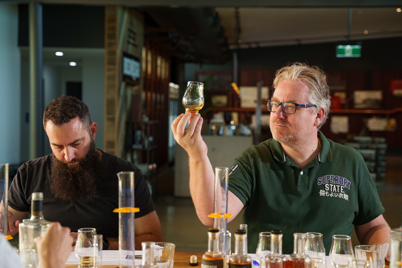 Two men doing rum tasting at Beenleigh Distillery.