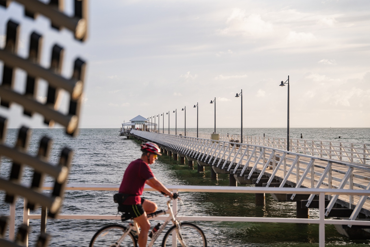 Brisbane_North Brisbane_Shorncliffe Pier_Cyclist and jetty_2023_Landscape