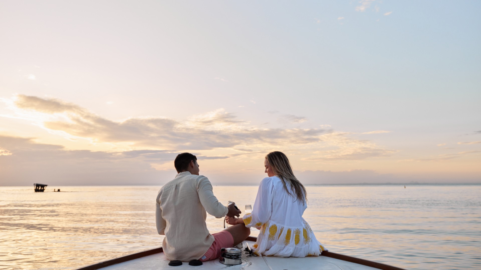 Couple sitting at moreton island/mulgumpin