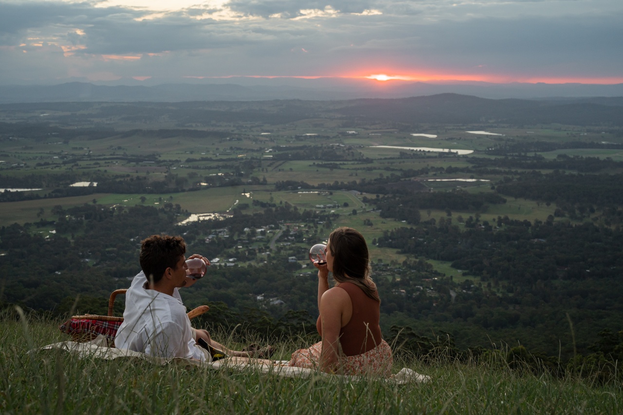 Couple picnicking at sunset on Tamborine Mountain
