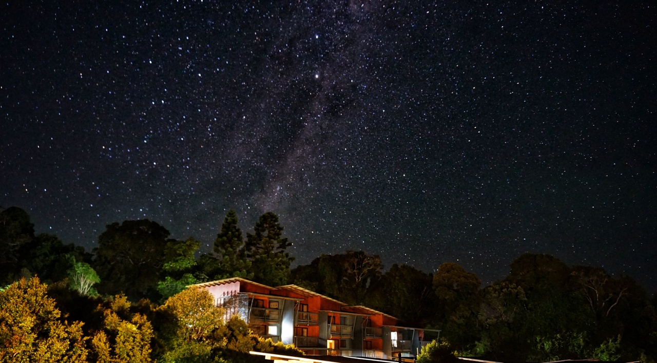 Shot of night sky and stars above building, O'Reilly's Rainforest Retreat.